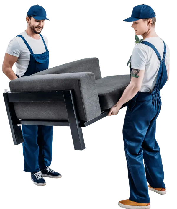 Two professional movers lifting and carrying a sofa towards a moving truck